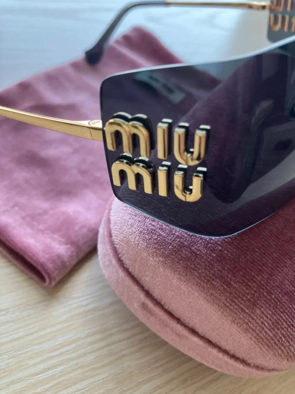 Miu Miu MU54YS Gold Logo Rimless Sunglasses
